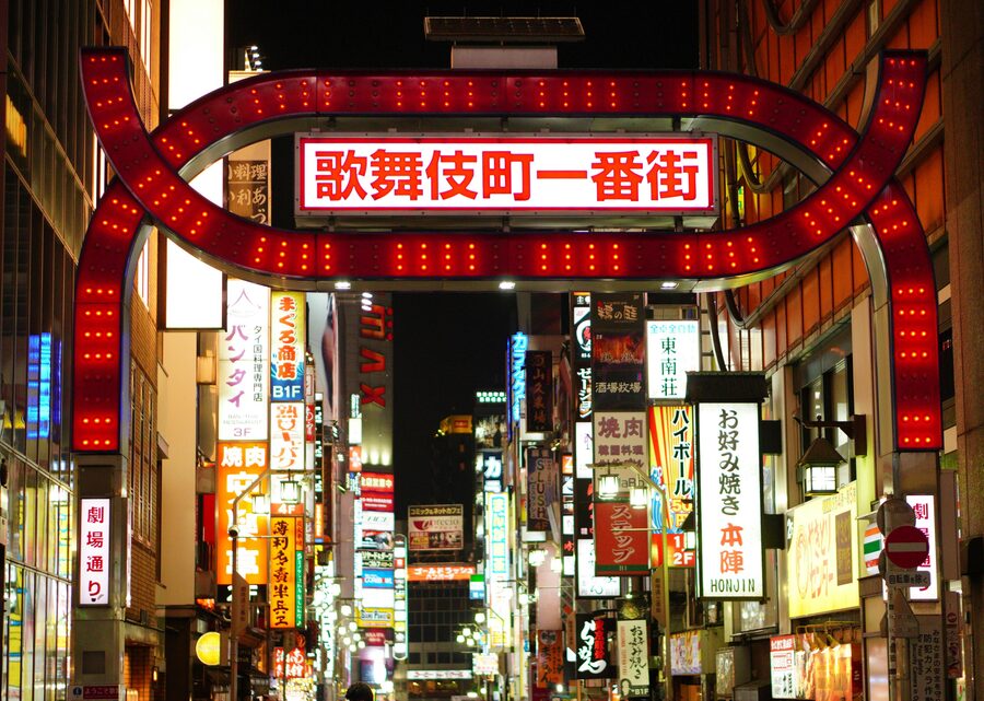Kabukicho entertainment district in Shinjuku at night with neon signage